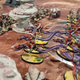 Miniatures of Eel-riding elves of the Idoneth Deepkin and Skeletal Ossiarch Bonereapers clash in a game of Warhammer: Age of Sigmar.